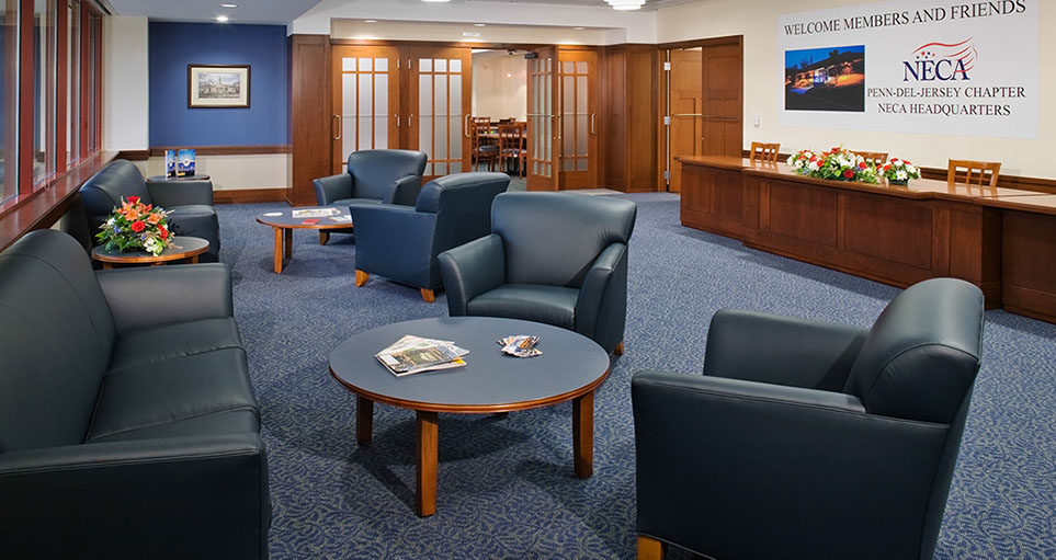 a room with blue chairs and a table