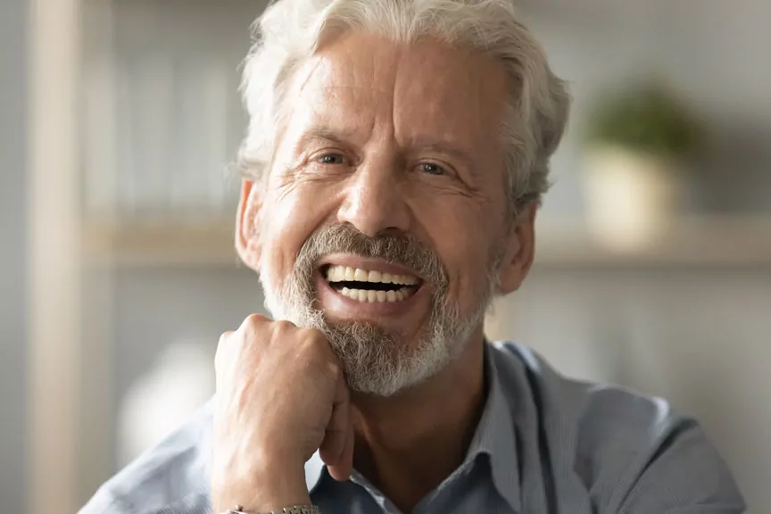 a man with a beard laughing