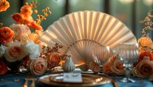 a table with flowers and a fan