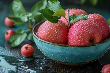 a bowl of apples with water droplets on it