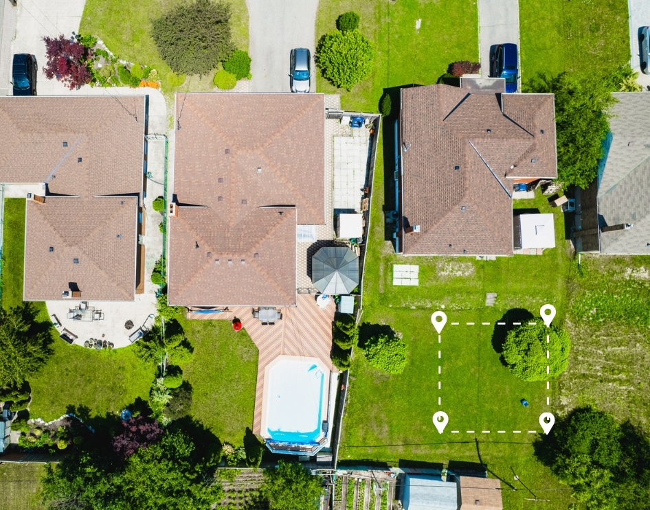 aerial view of a neighborhood with houses and a pool