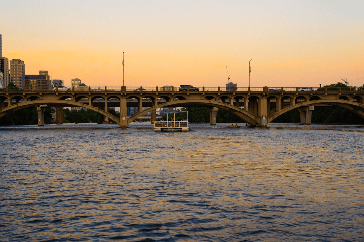 a bridge over water with a boat