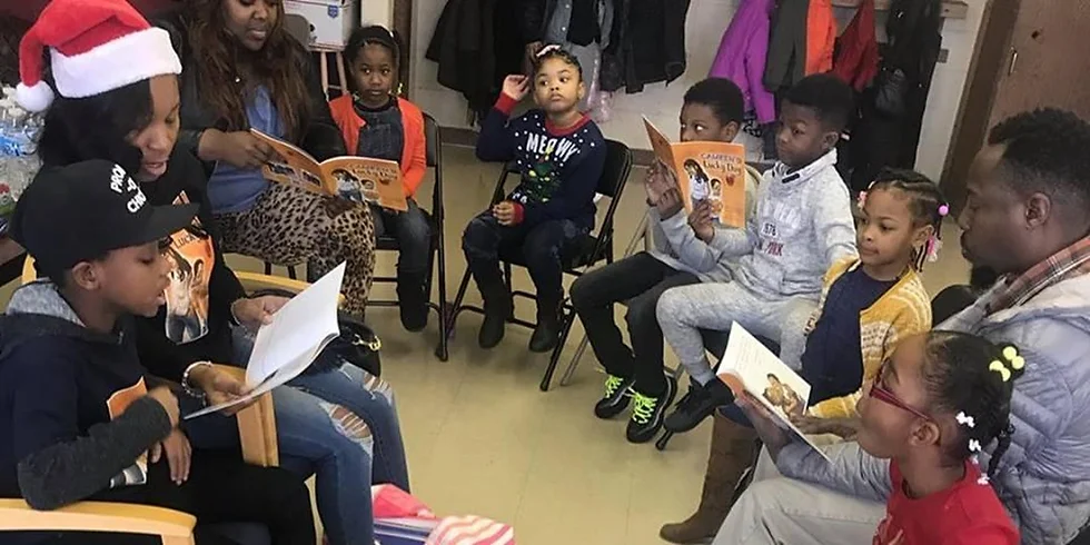 a group of children sitting in chairs reading books