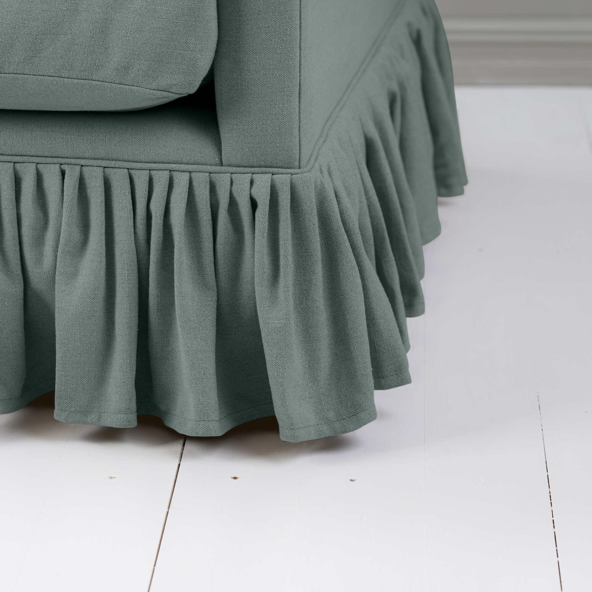 a close up of a ruffled couch
