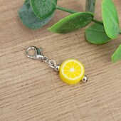 a key chain with a lemon slice on it
