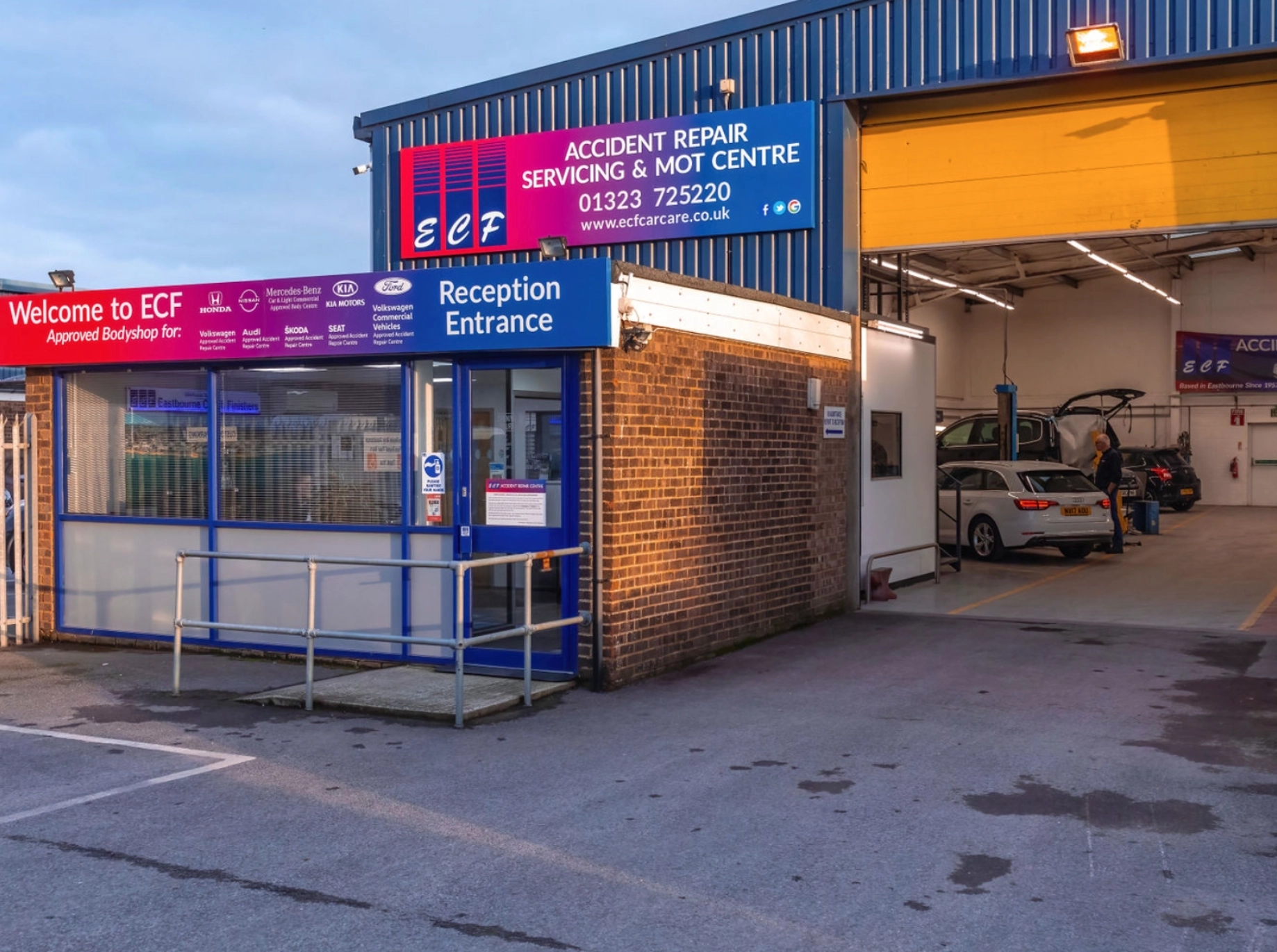 a car repair shop with a sign