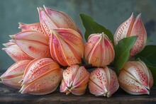 a group of flowers with green leaves