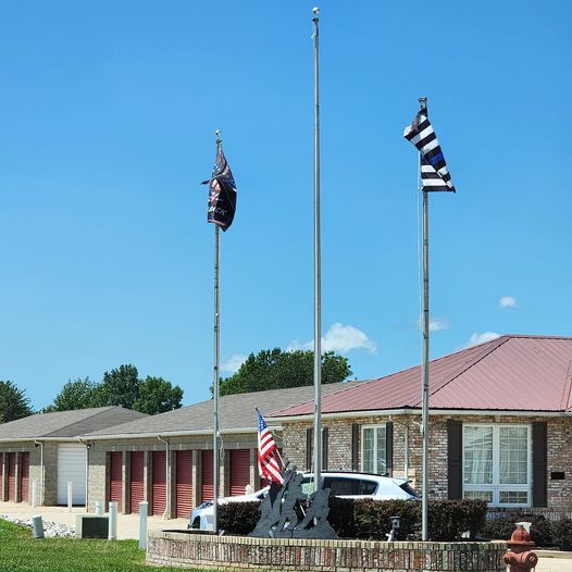 a building with flags on poles