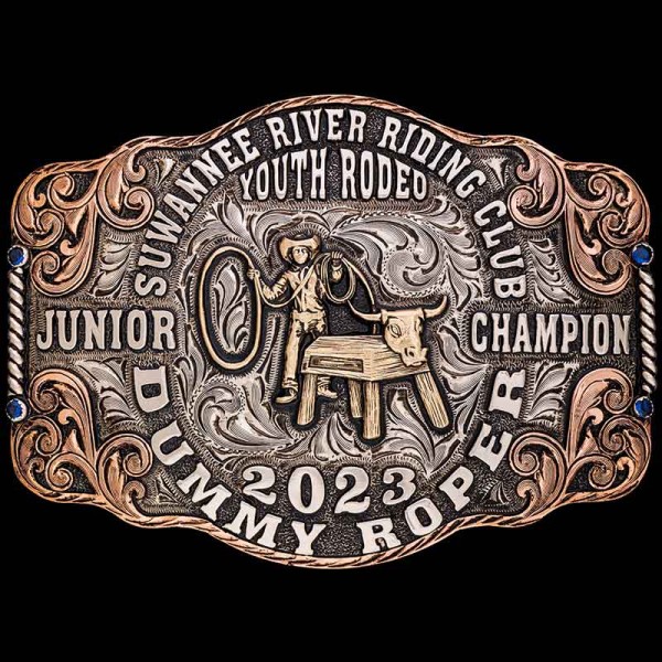 a silver belt buckle with a cowboy on a bench
