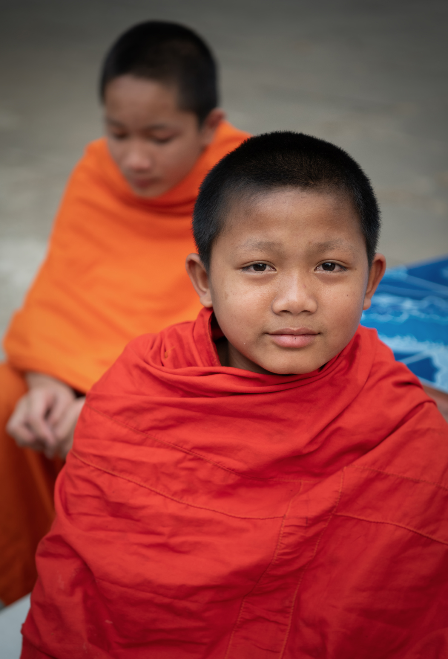 a boy in orange robes