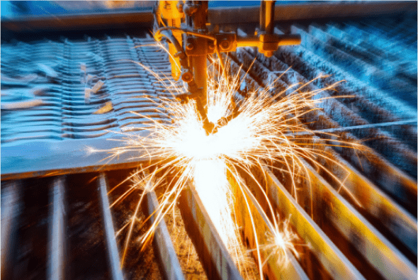 a machine cutting metal with sparks