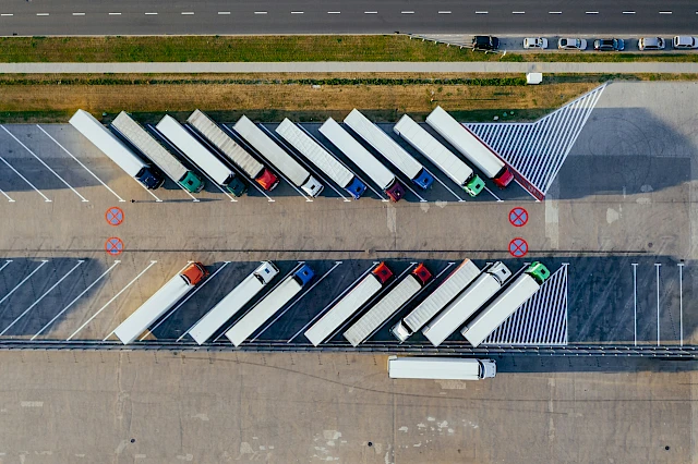 a group of trucks parked in a parking lot