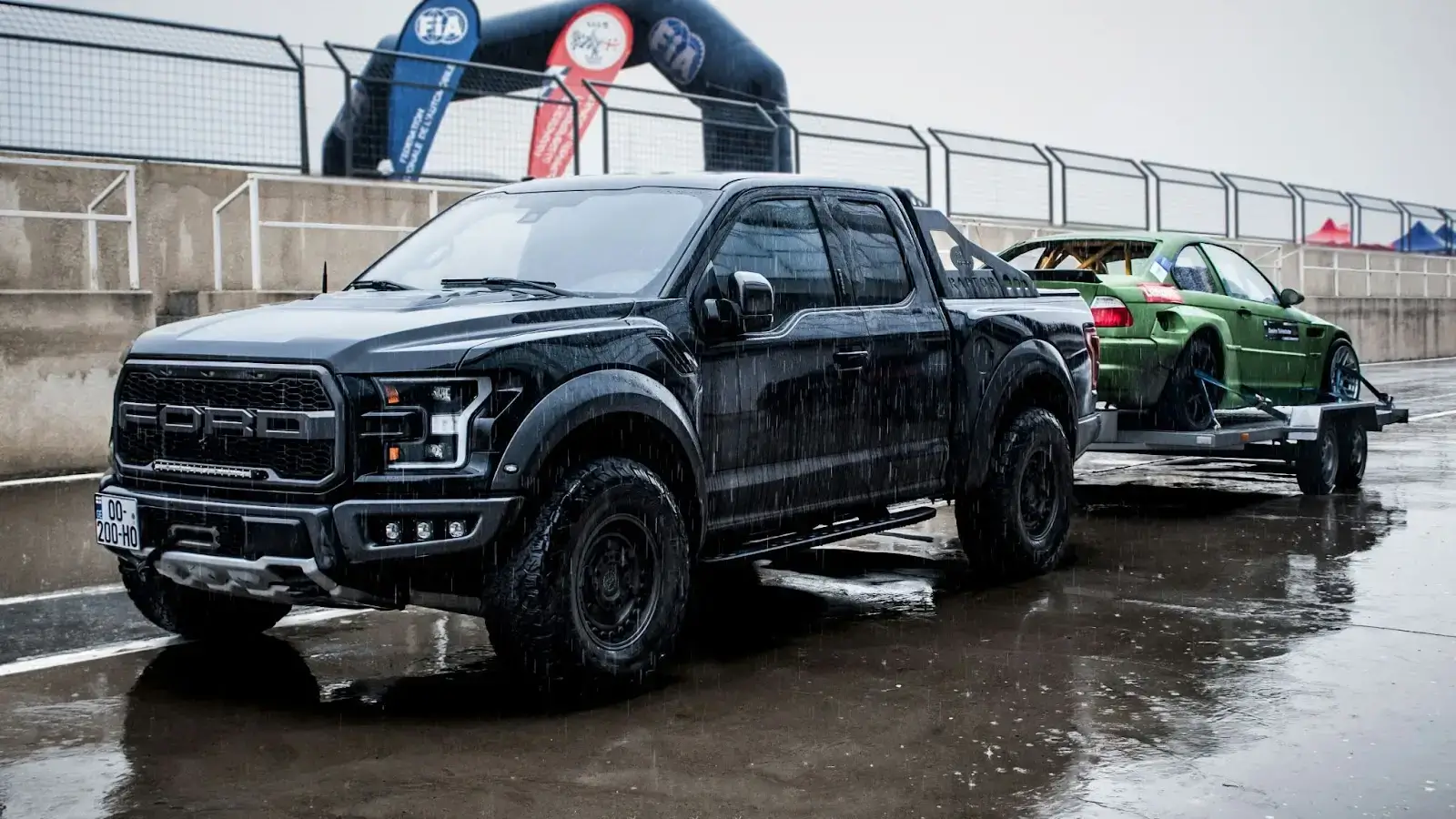 a black truck parked in a parking lot