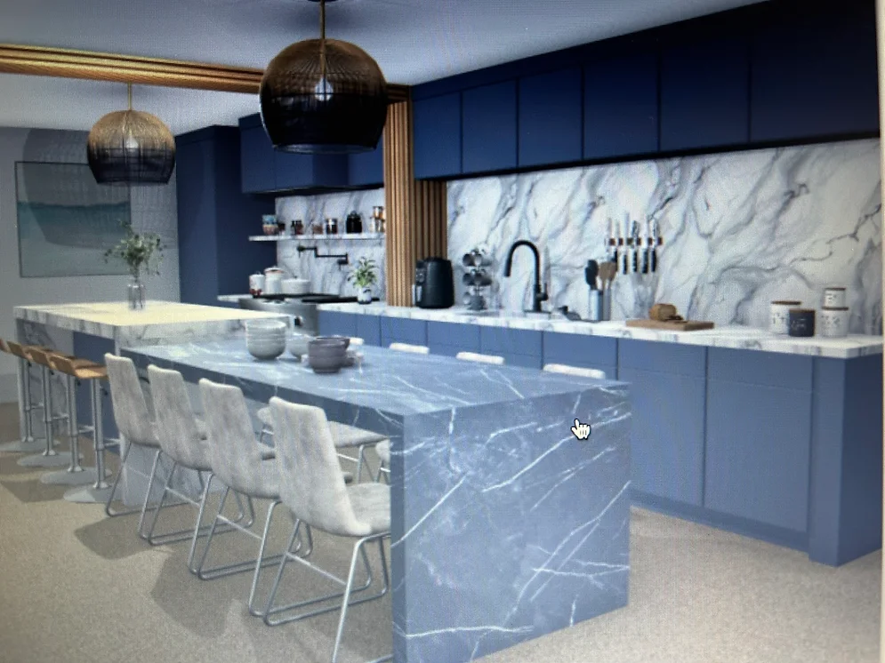 a kitchen with a marble island and chairs