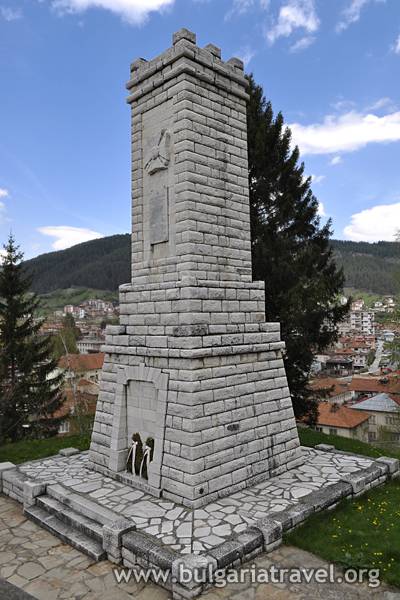 a stone tower with a tower in the middle