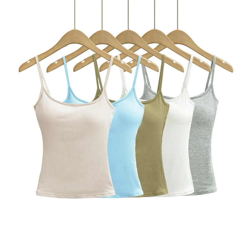 a group of different colored tank tops