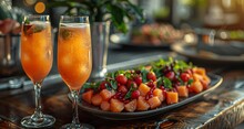 a plate of fruit and a drink