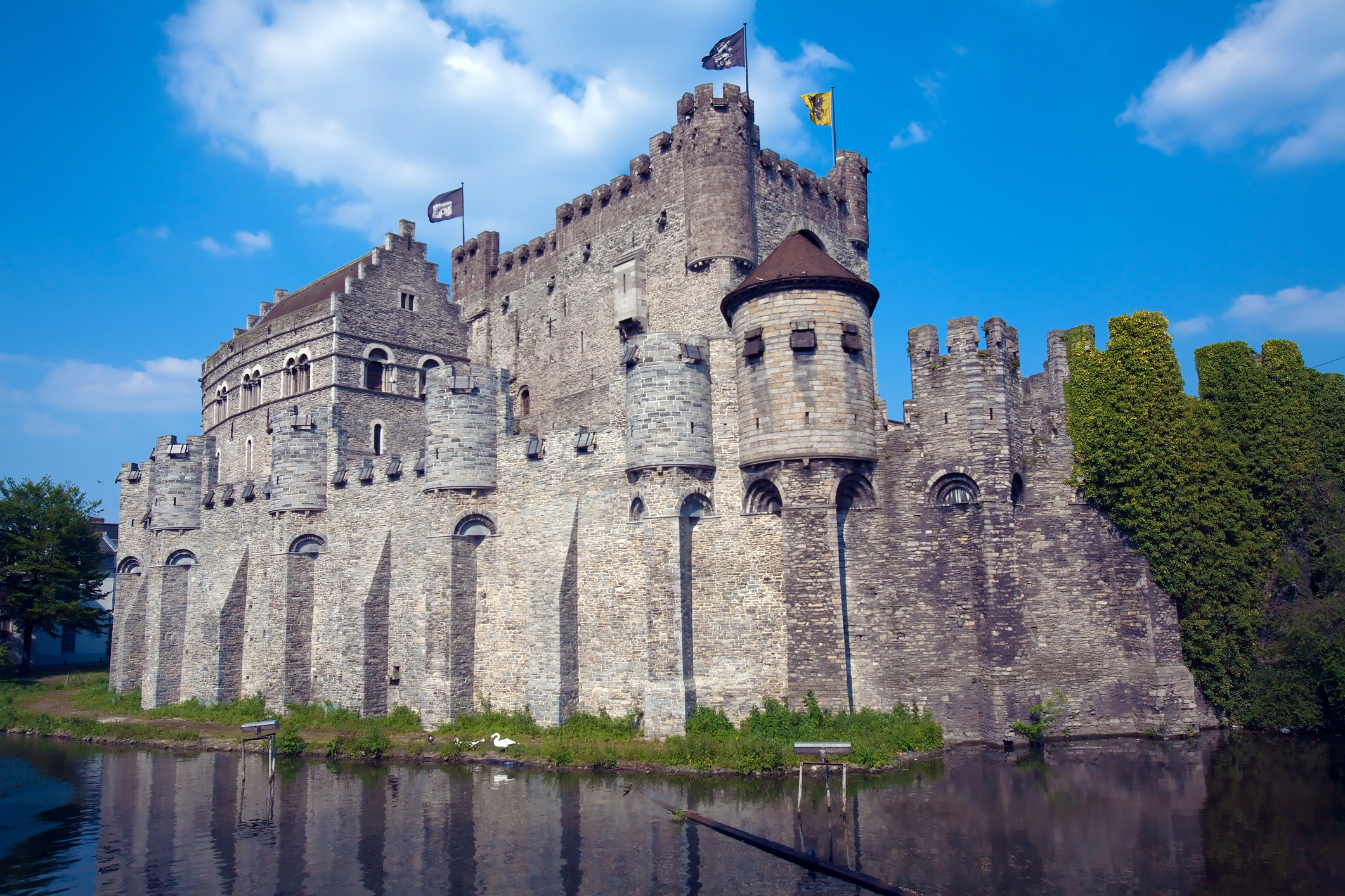 a castle with a body of water with Gravensteen in the background