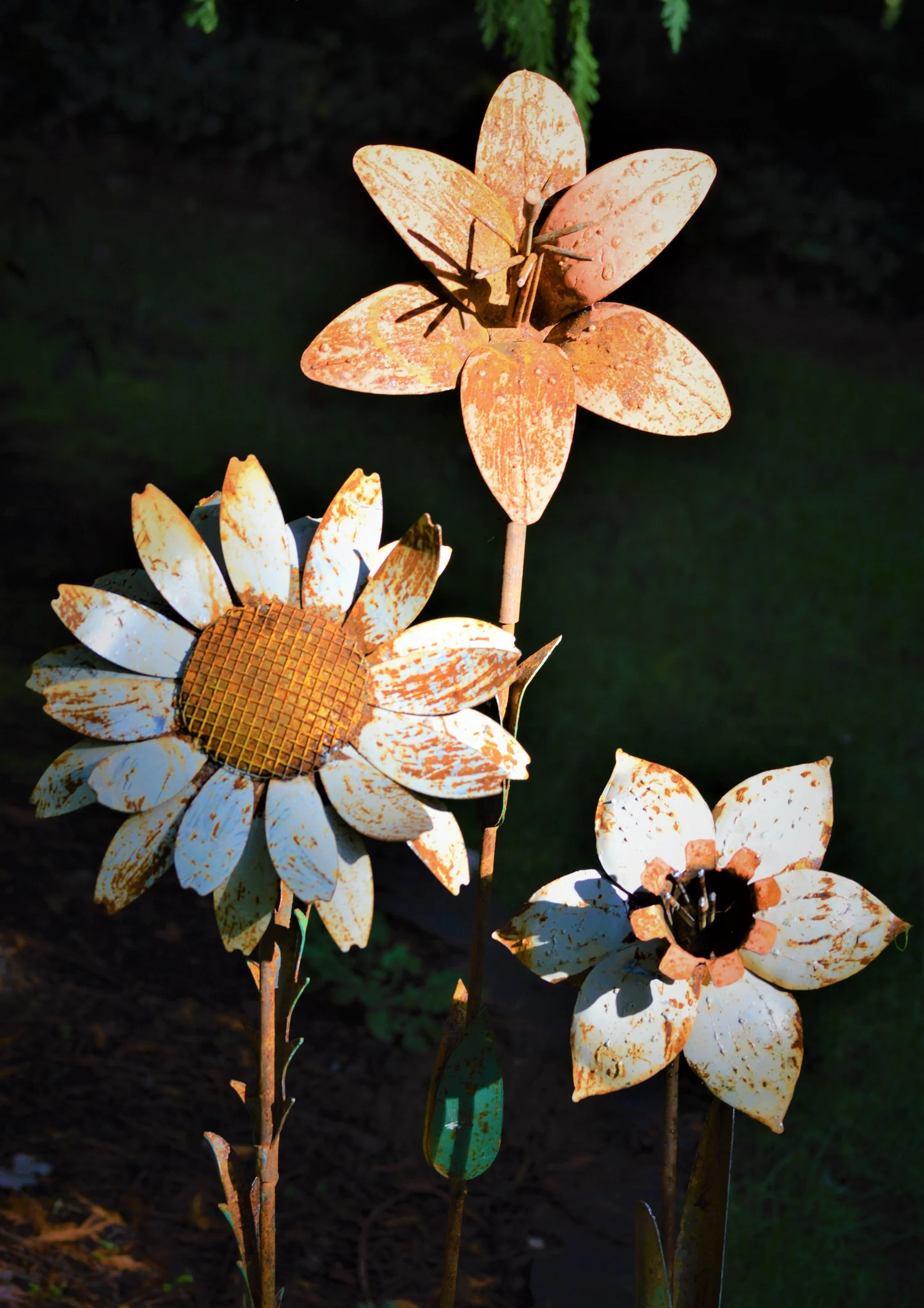 a group of metal flowers