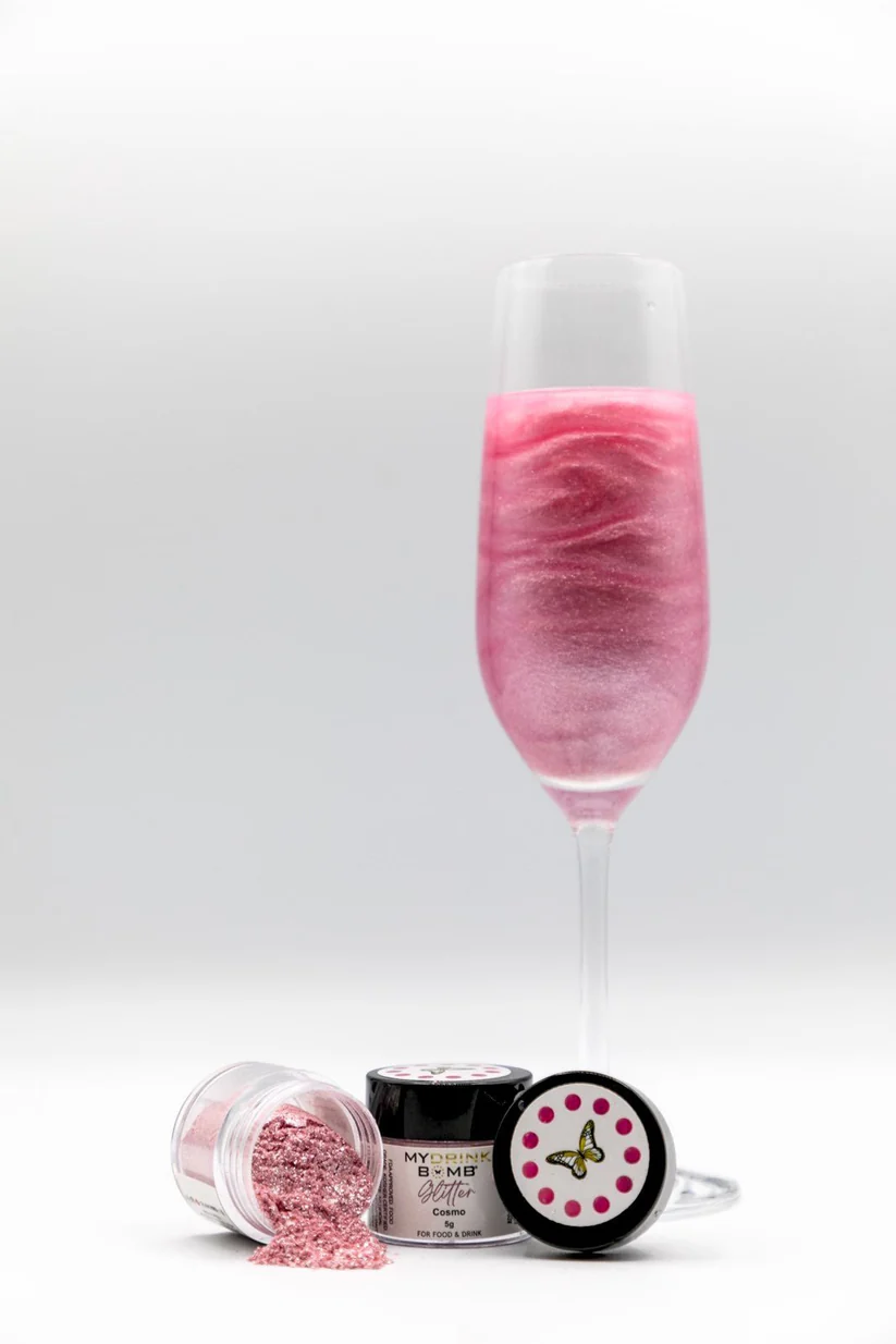 a glass of pink liquid