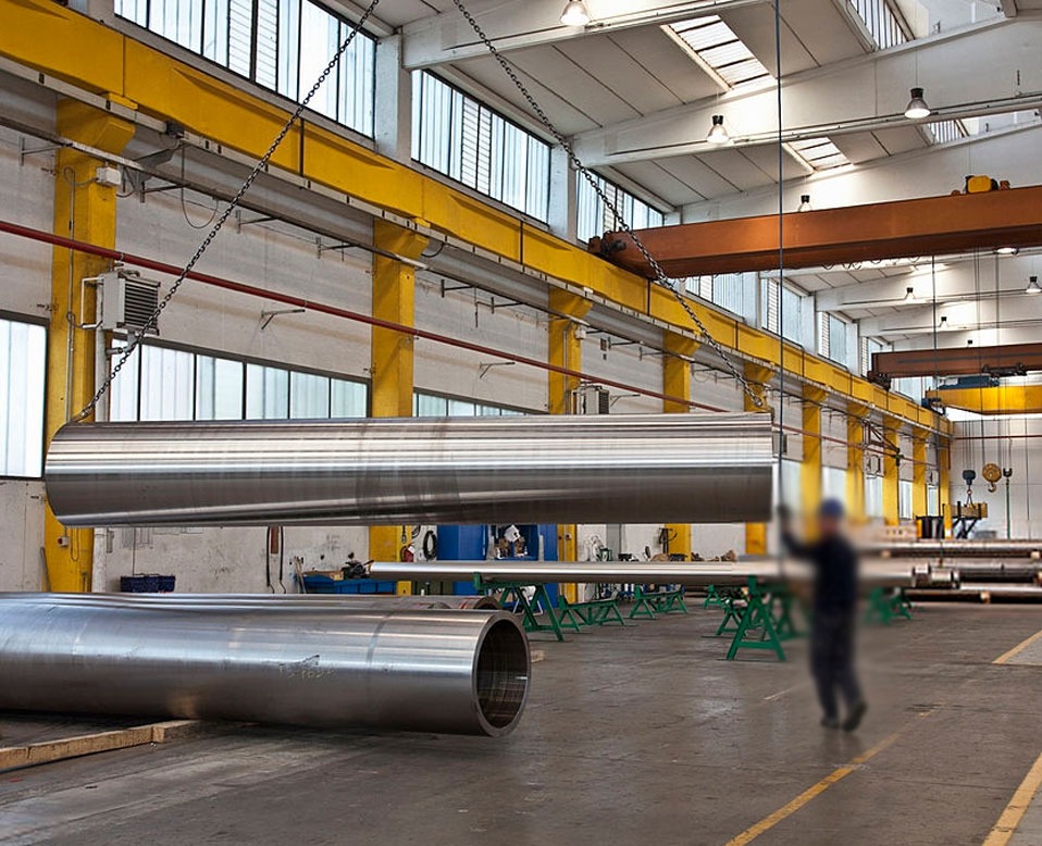 a large warehouse with large metal pipes