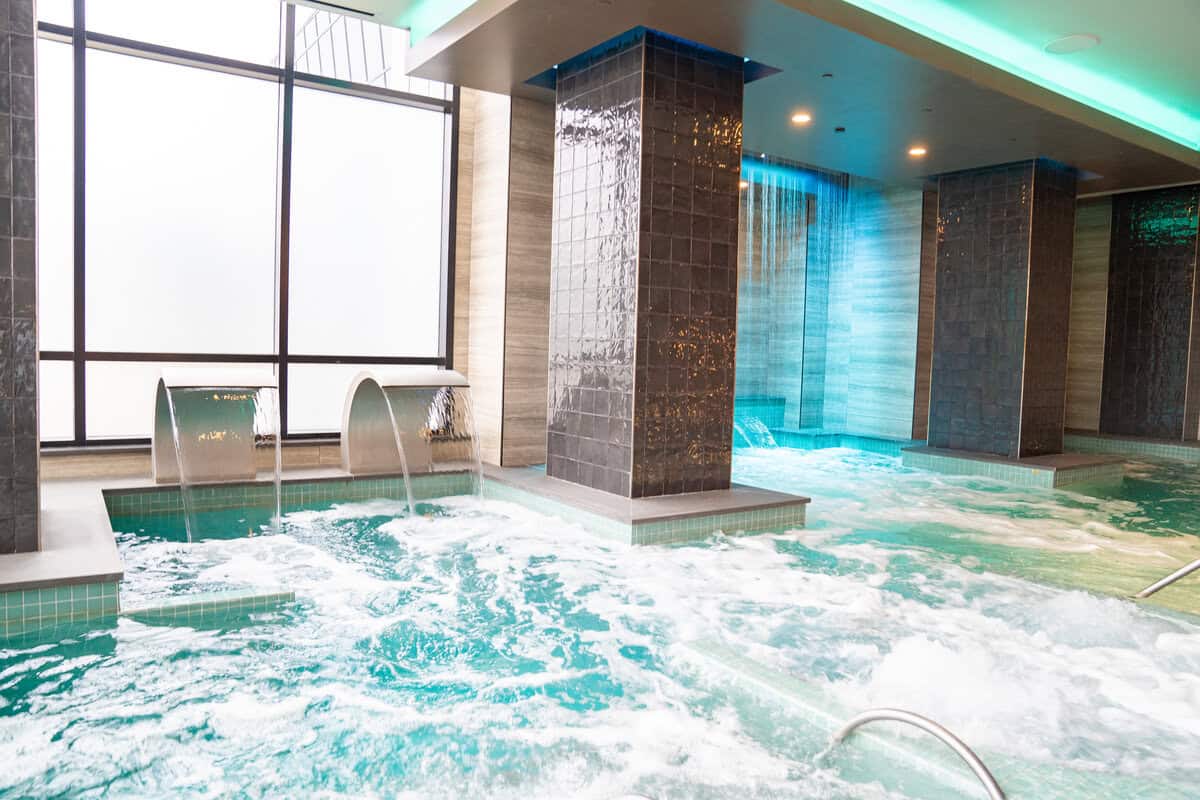 a large indoor jacuzzi with water running out of it