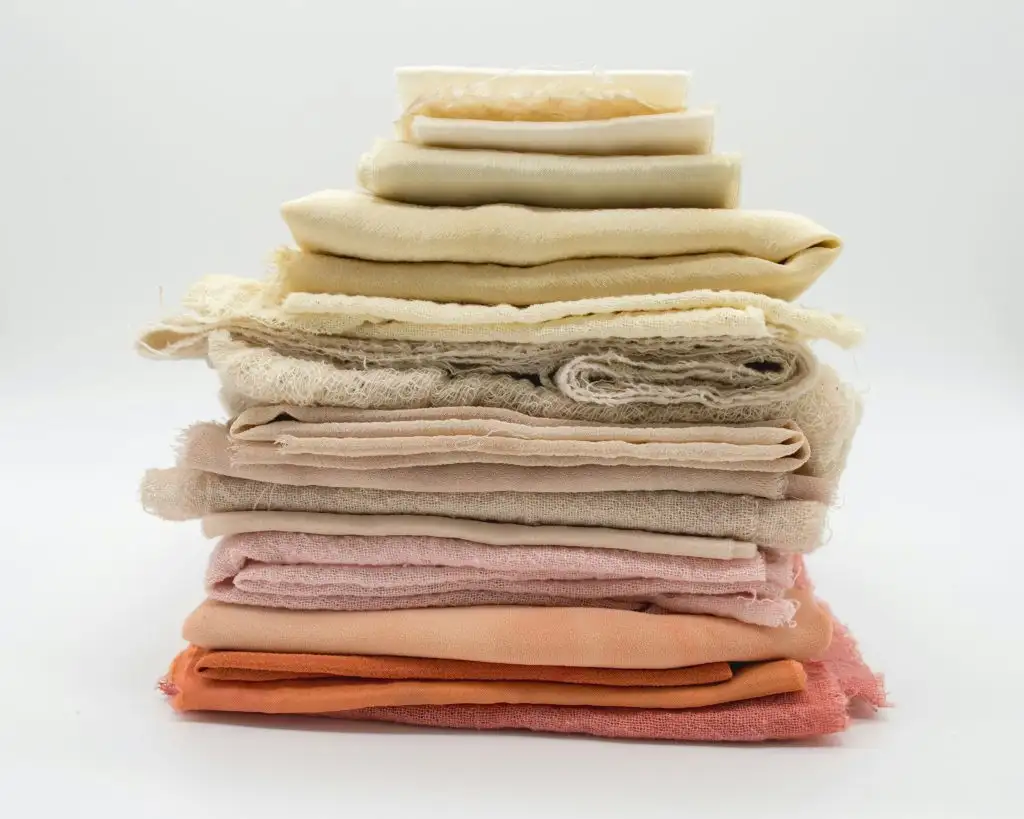 a stack of fabric on a white background