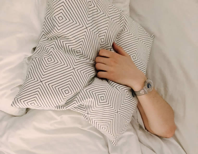 a person's arm on a pillow