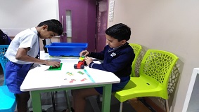 a group of boys playing with toys