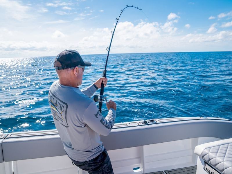 a man fishing on a boat