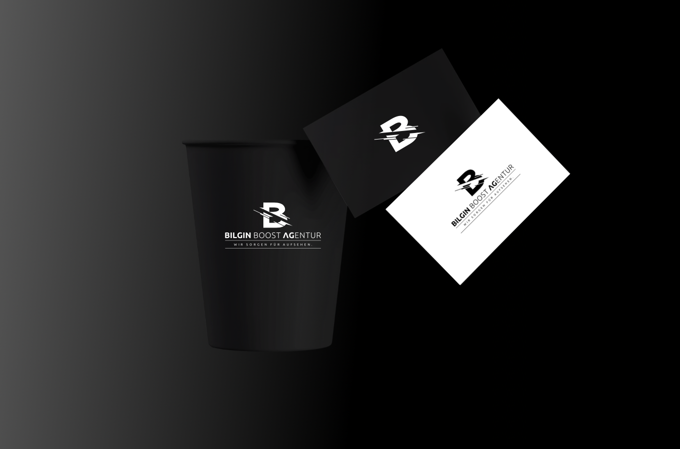 a black cup with a white card next to it