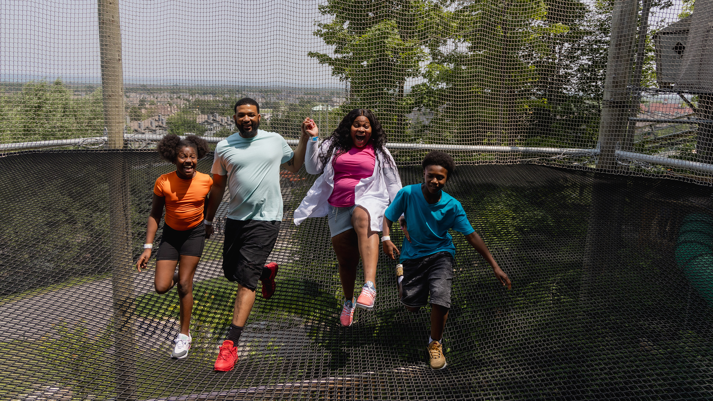 a group of people running on a trampoline