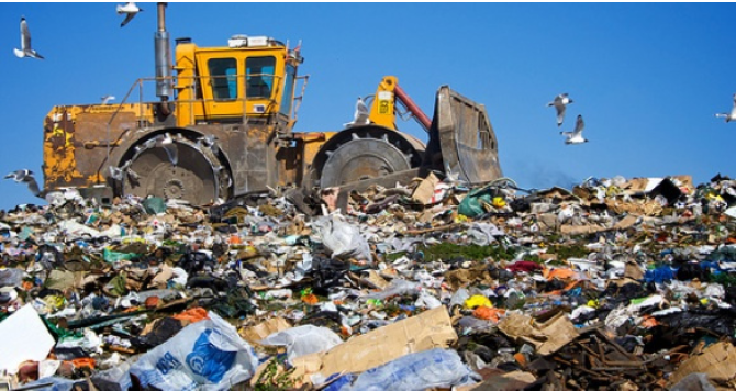 a bulldozer in a landfill