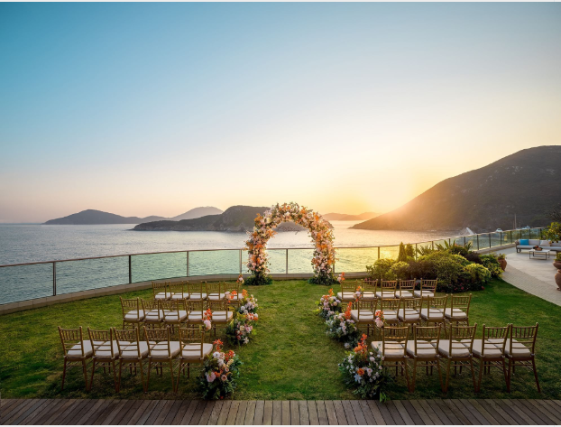 a wedding ceremony set up with chairs and flowers