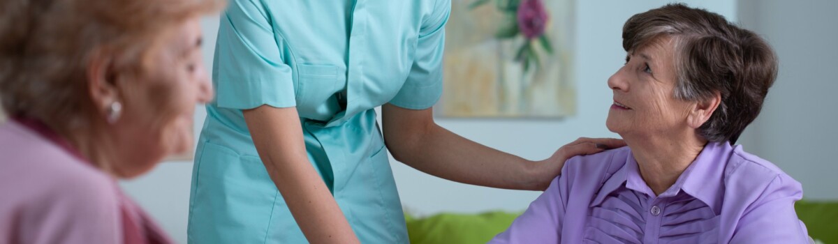 a nurse touching a patient's back