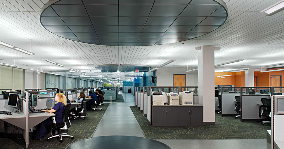 a room with people working at computers