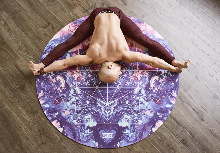a man lying on a yoga mat