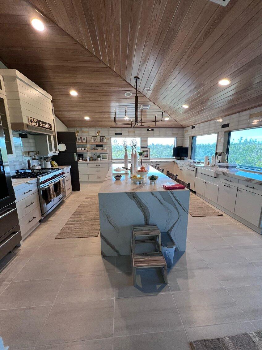 a large kitchen with a large island