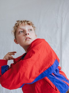a person in a red and blue jacket