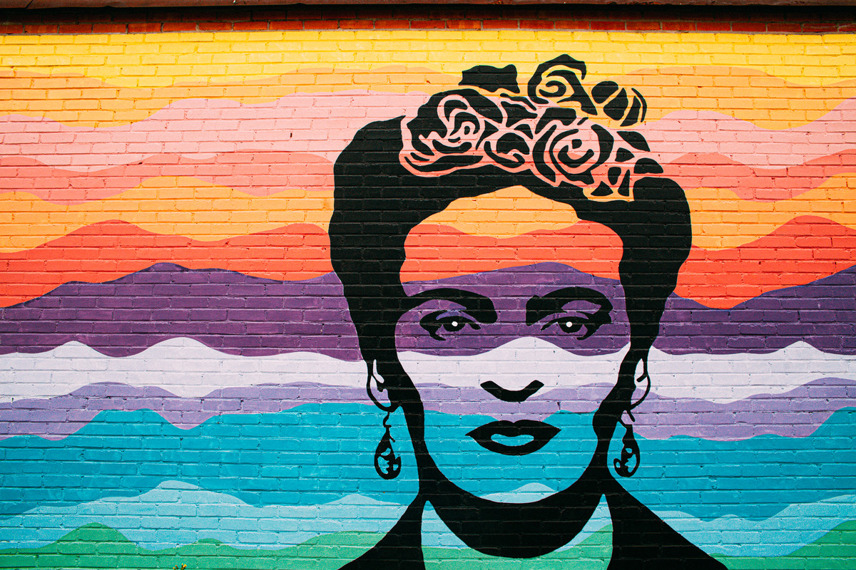 a mural of a woman with flowers on her head