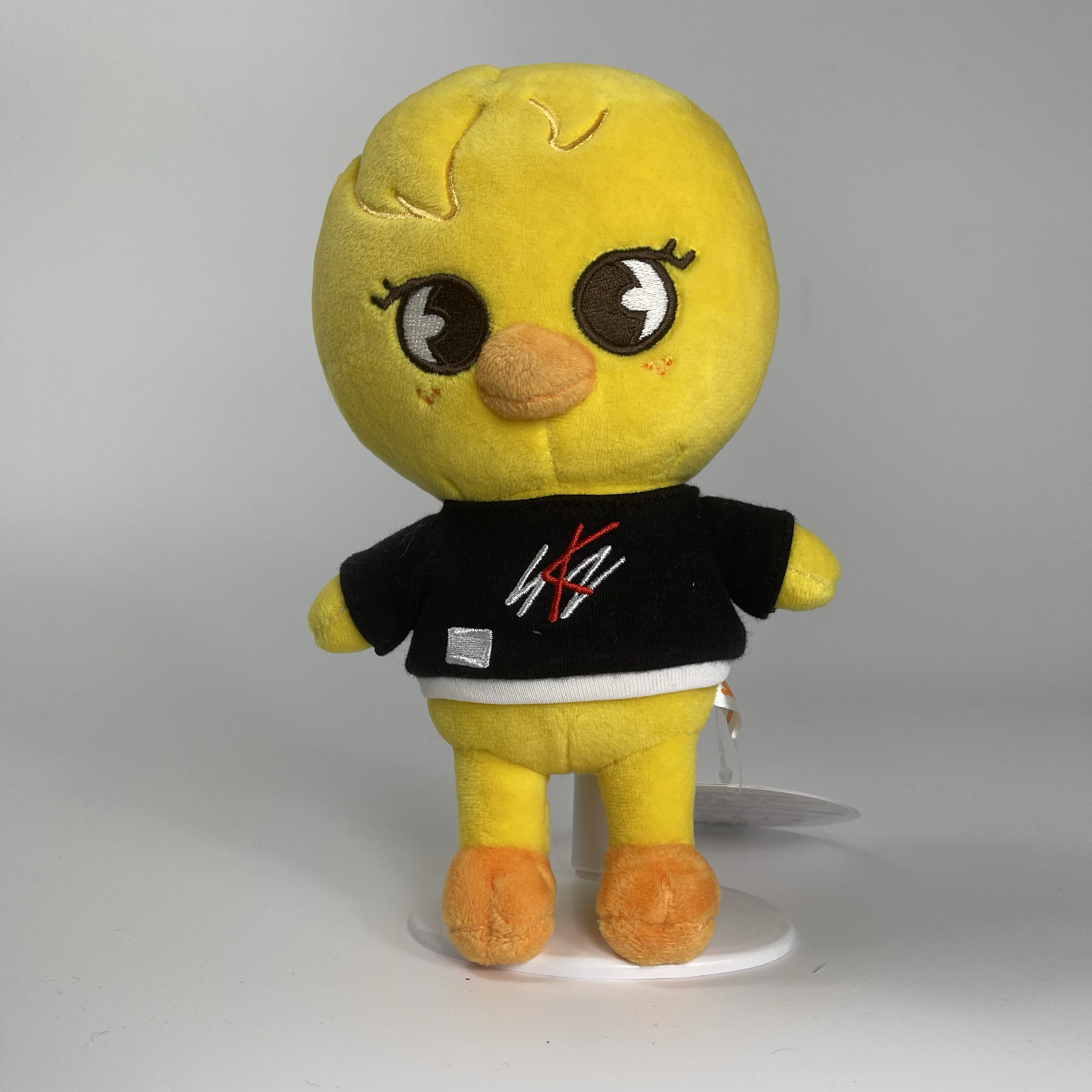 a stuffed animal toy with a black shirt