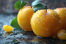 a pair of yellow apples with leaves