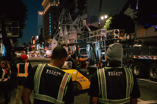 a group of men in reflective vests