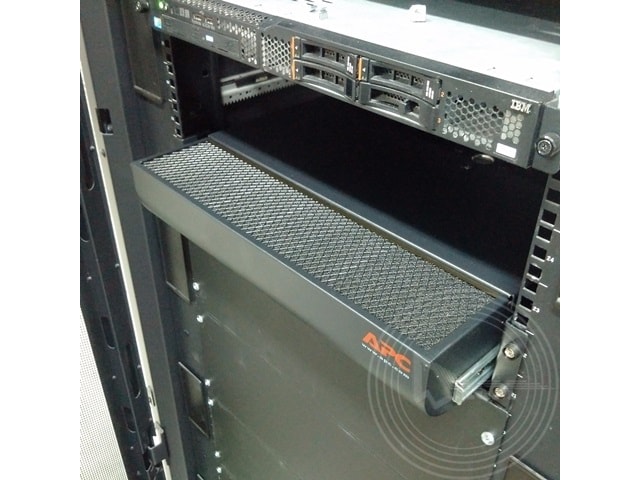 a black computer server with a shelf