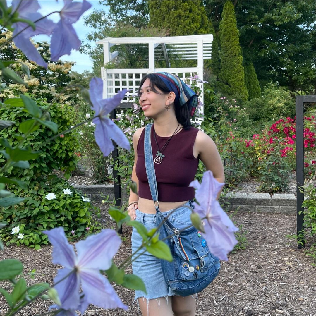 a woman standing in a garden