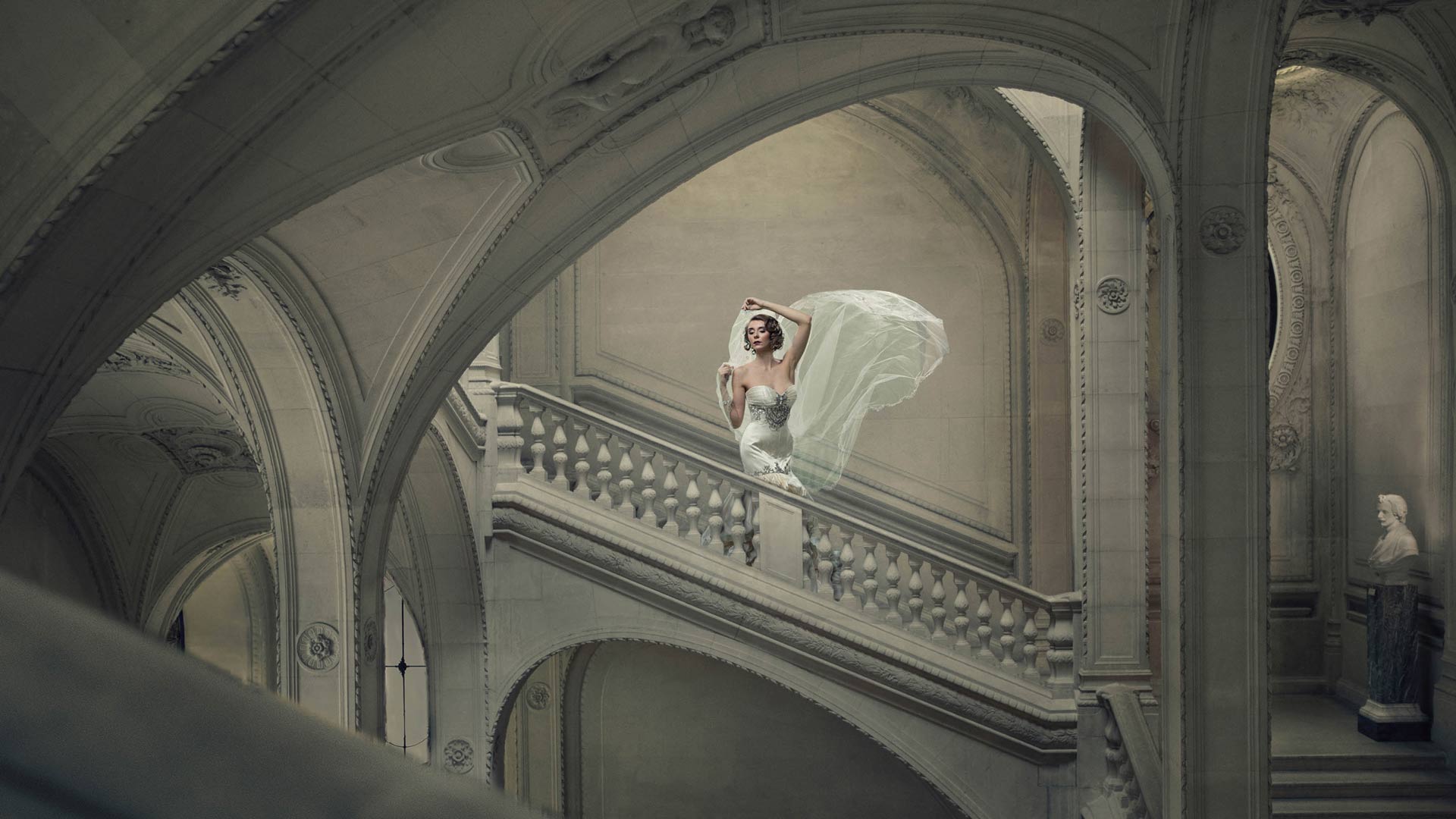 a woman in a white dress on a staircase