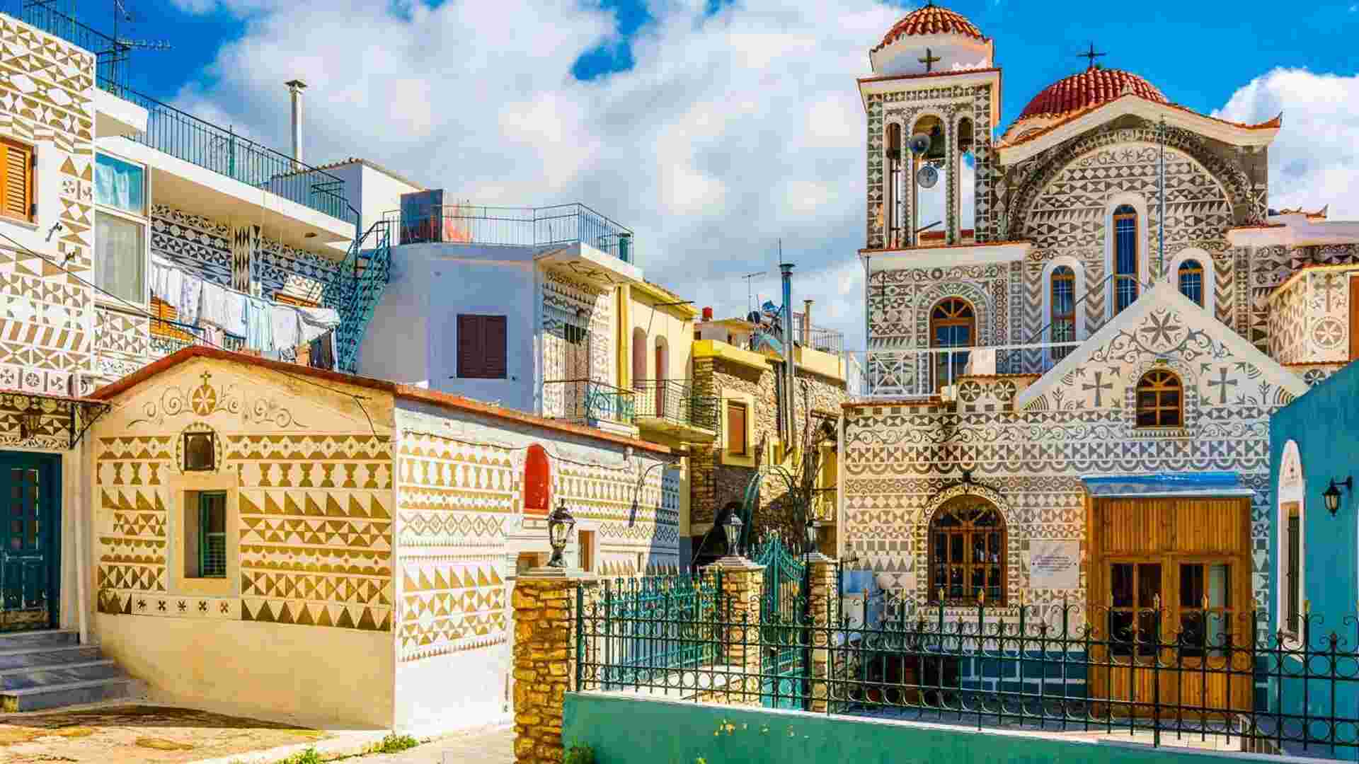 a building with a bell tower and a gate