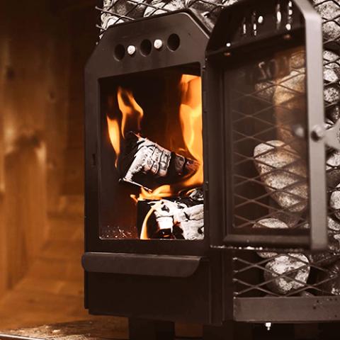 a wood burning stove with fire inside