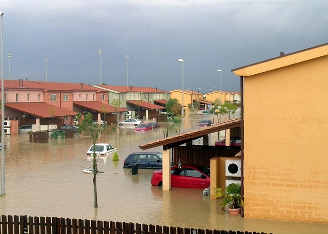 a flooded neighborhood with cars and cars