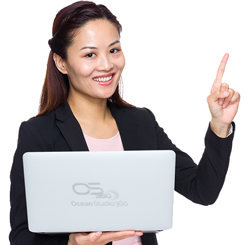 a woman holding a laptop and pointing up